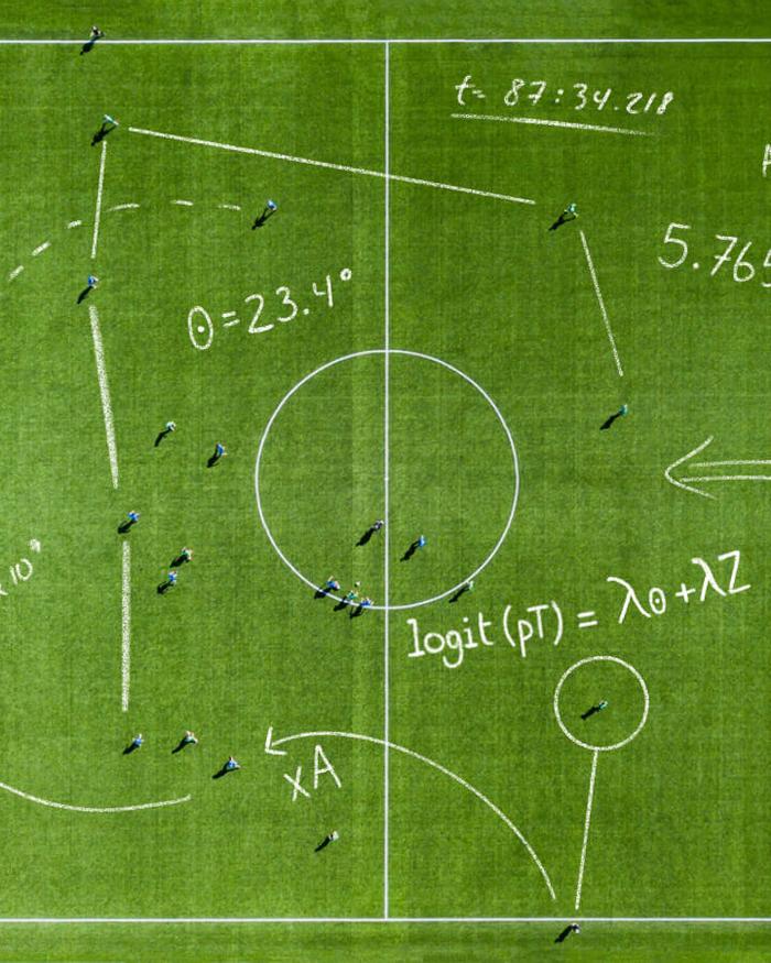 Aerial view of a soccer pitch overlaid with hand-drawn statistical equations, angles, and analytics notations