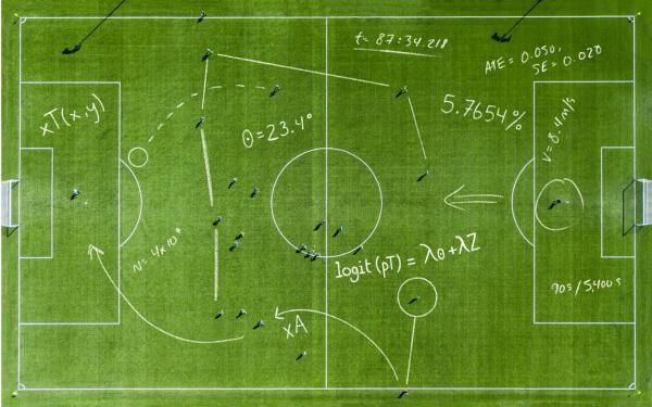 Aerial view of a soccer pitch overlaid with hand-drawn statistical equations, angles, and analytics notations