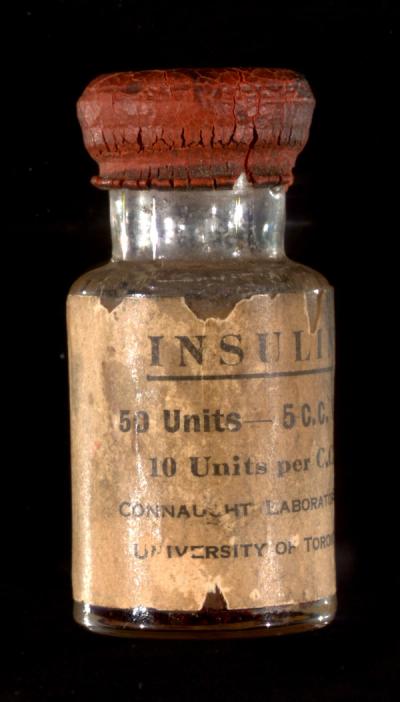 A photograph of an early vial of insulin.