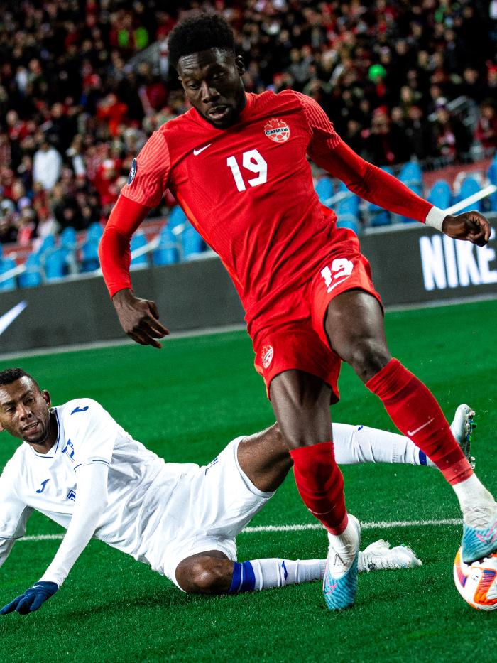 Alphonso Davies playing for Canada's national team vs Honduras at BMO Field in 2023