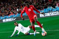 Alphonso Davies playing for Canada's national team vs Honduras at BMO Field in 2023