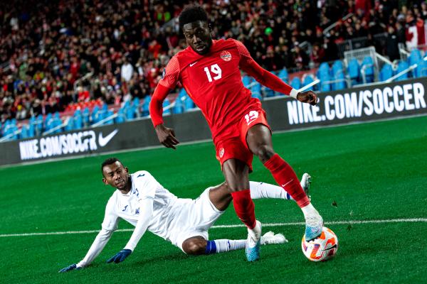 Alphonso Davies playing for Canada's national team vs Honduras at BMO Field in 2023