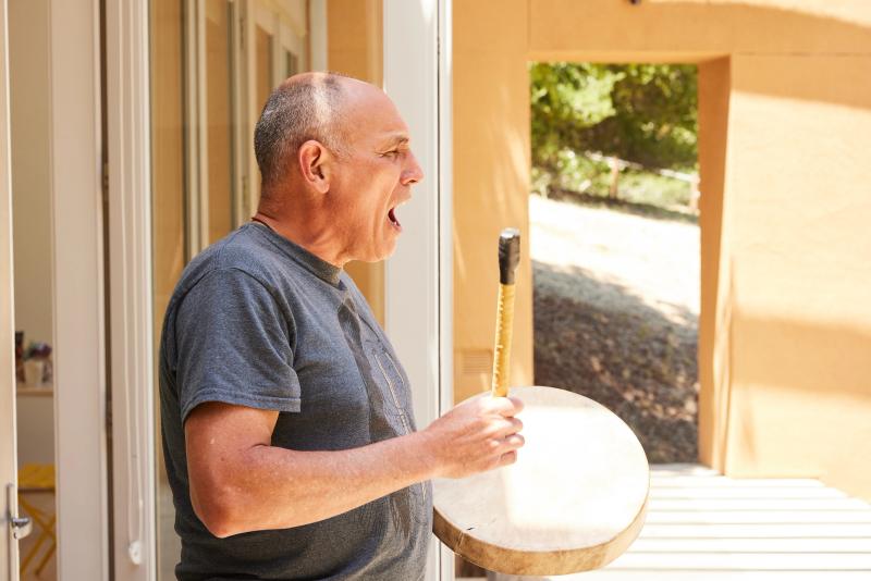 Archer Pechawis drumming at the Future Imaginaries of Indigenous AI Residency. 

Montalvo Arts Center, Saratoga, California in May 2023