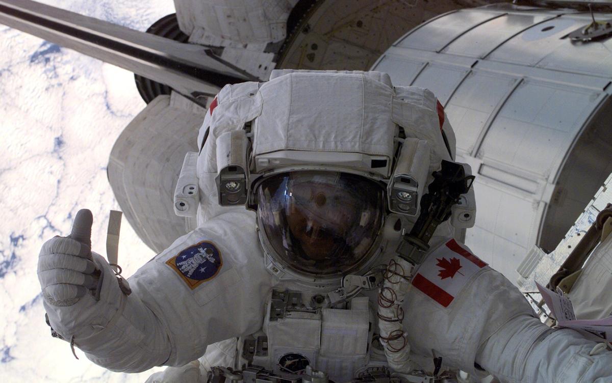 Canadian Space Agency (CSA) astronaut Chris Hadfield gives fellow astronauts the thumbs up during the first space walk (EVA-1) of the STS-100 mission.