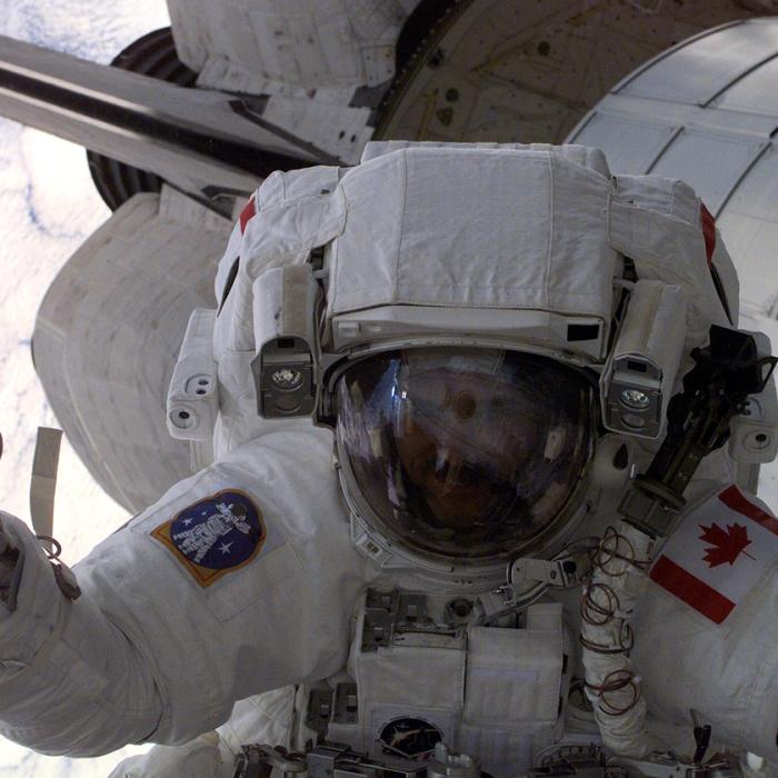 Canadian Space Agency (CSA) astronaut Chris Hadfield gives fellow astronauts the thumbs up during the first space walk (EVA-1) of the STS-100 mission.