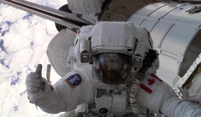 Canadian Space Agency (CSA) astronaut Chris Hadfield gives fellow astronauts the thumbs up during the first space walk (EVA-1) of the STS-100 mission.