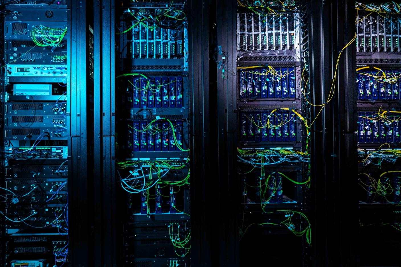 quantum computer, servers and wiring with a blue light shining