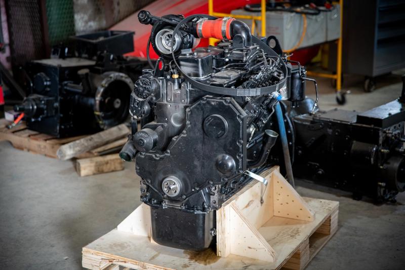 An engine waits on a wooden pallet to be installed at Ursa Ag's shop in Bowden, Alta.