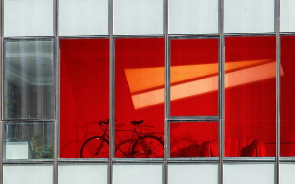 An artist's interpretation of how the squid-inspired window would work if installed in a commercial building, with colours representing changes in heat and light