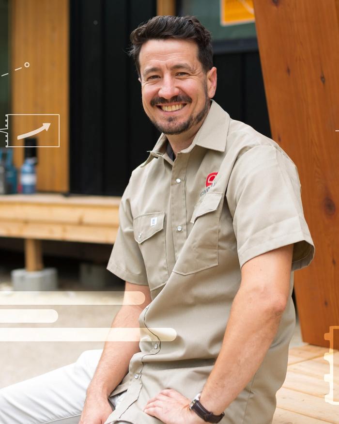 Logan Ashley wears a beige uniform at a Good Way Homes site in B.C.
