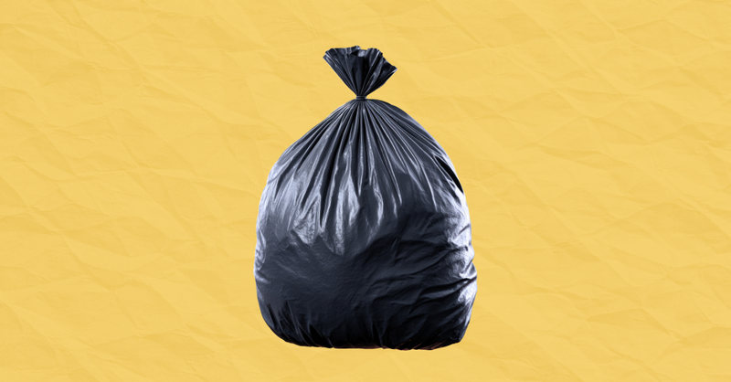 black garbage bag on yellow background
