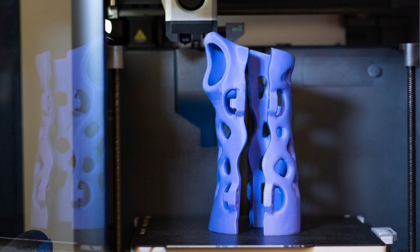A 3d printed brace inside a 3d printer at Polyunity