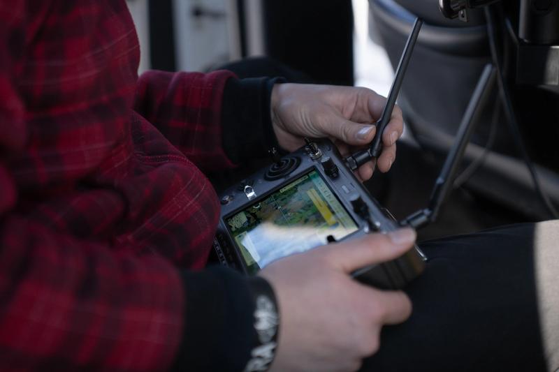 A drone operator sets up launch co-ordinates remotely from the launch truck.