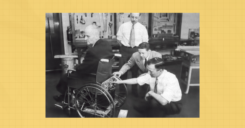 Scene of men tinkering with a wheelchair on a yellow background