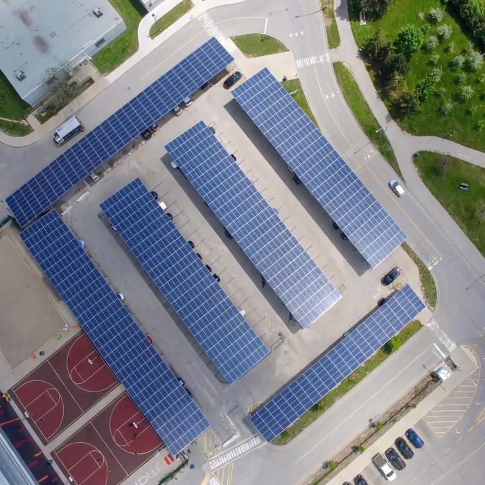 An aerial view of the photovoltaic solar panels over a solar carport parking lot at Mohawk College, in Hamilton, Ontario