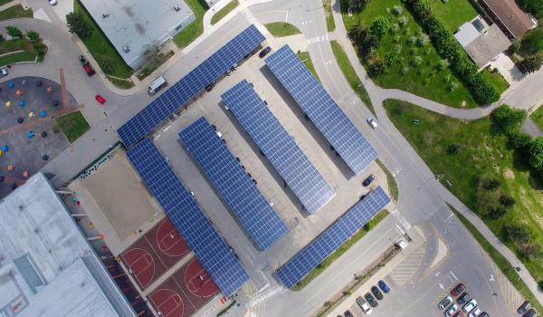 An aerial view of the photovoltaic solar panels over a solar carport parking lot at Mohawk College, in Hamilton, Ontario