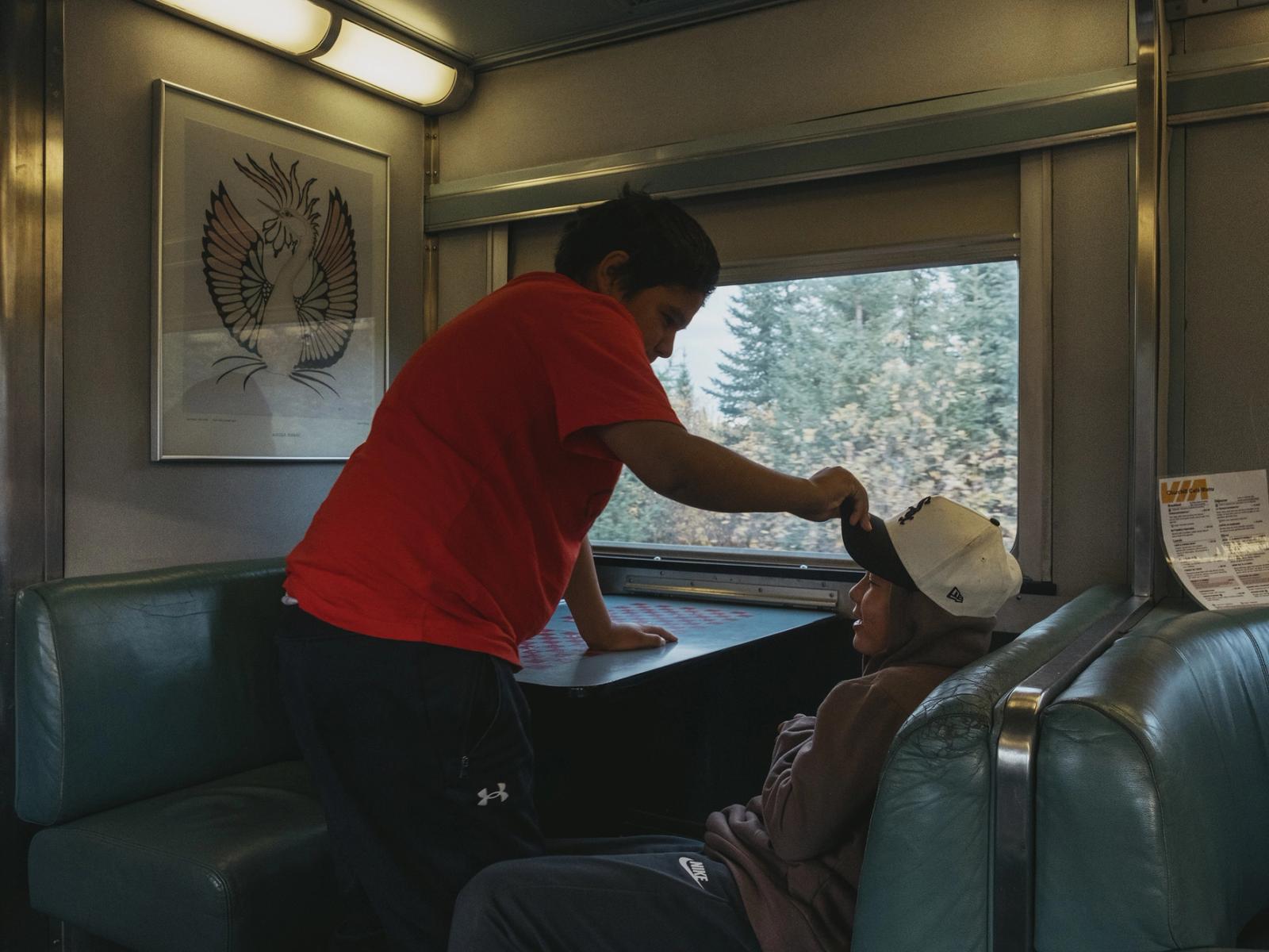 Kids play in the dining car on the train between Churchill and Thompson, Manitoba on September 27, 2026.