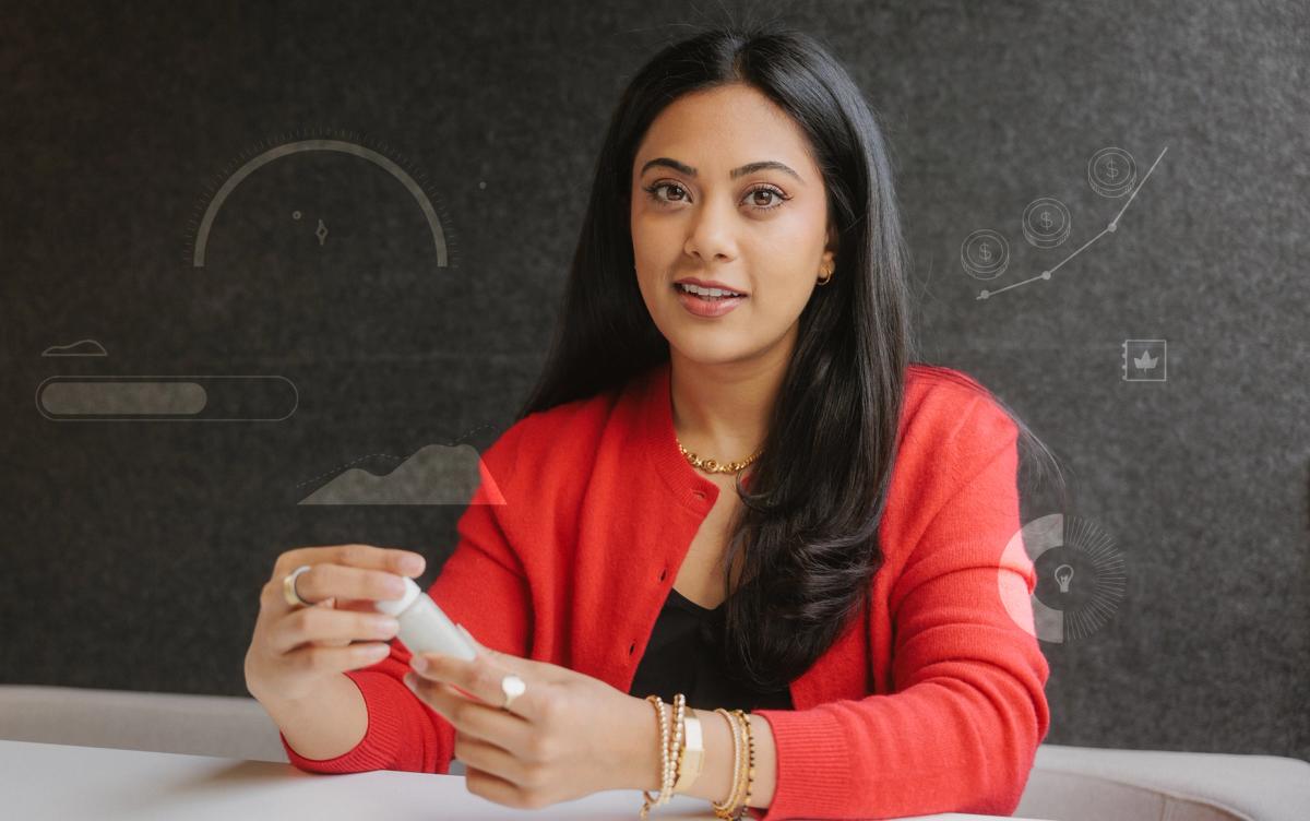 A portrait of Jaiya Varshney, the co-founder and chief operating officer of Tydra Labs, holding a vial of the company's fibrillated chitin