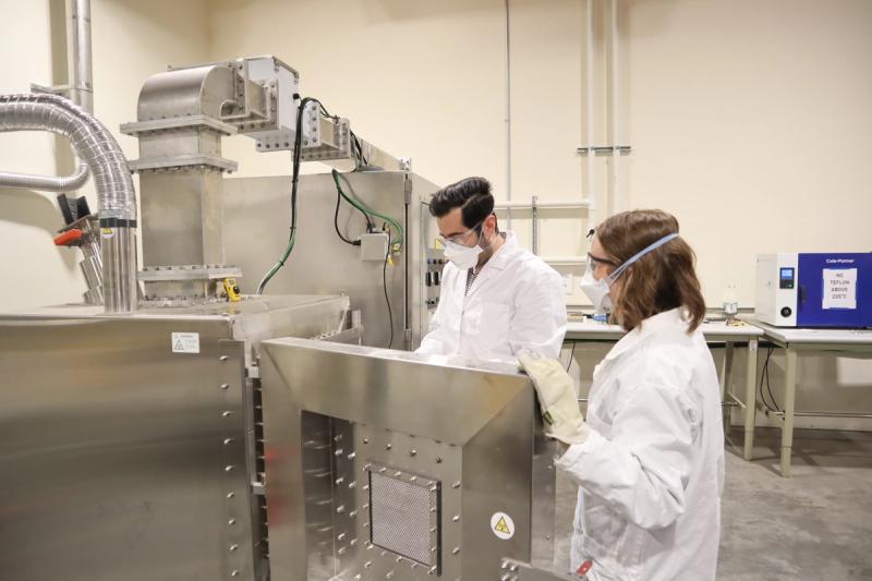 Arca scientists conducting mineral activation experiments in a lab using microwaves