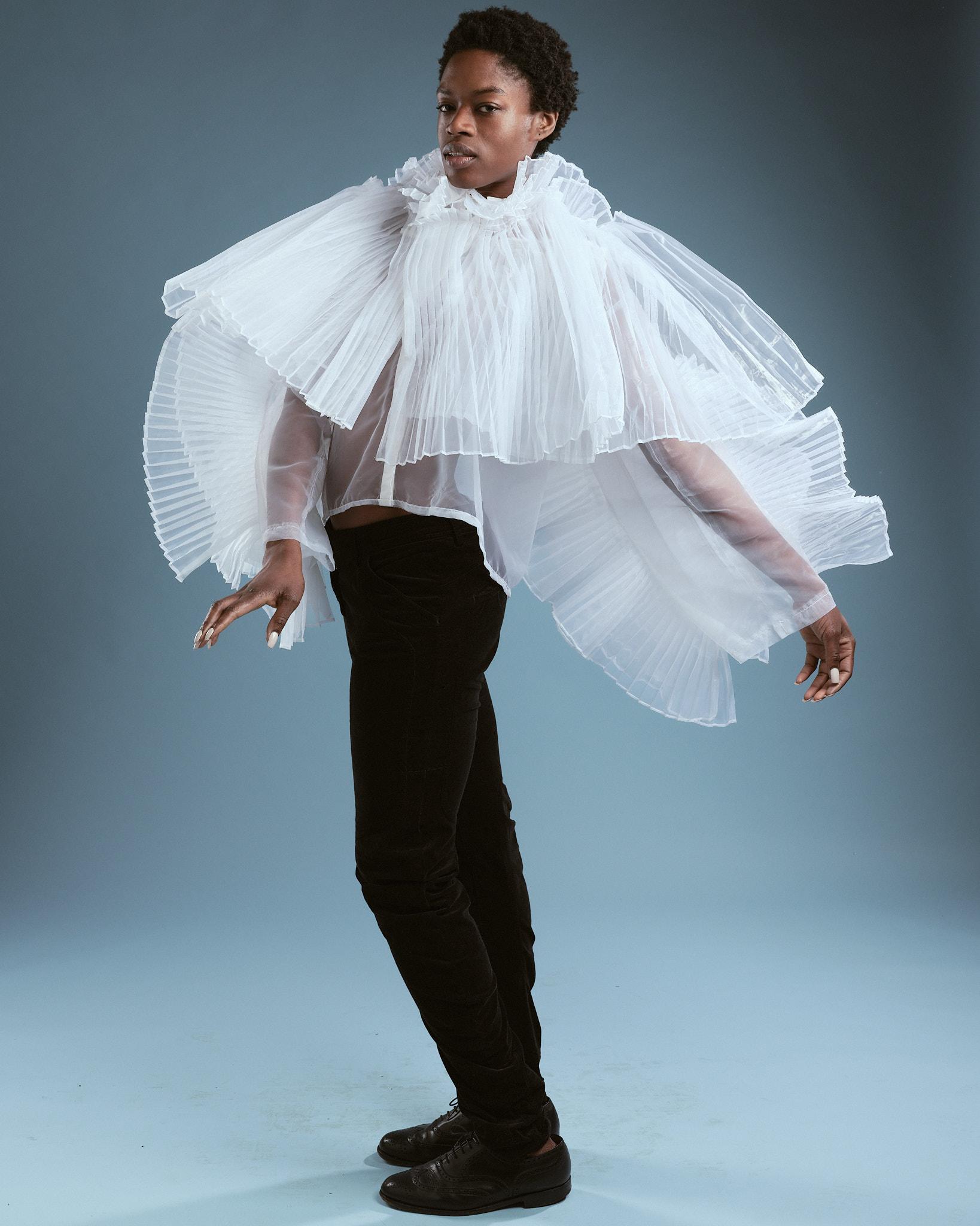Photograph of a male model wearing a white