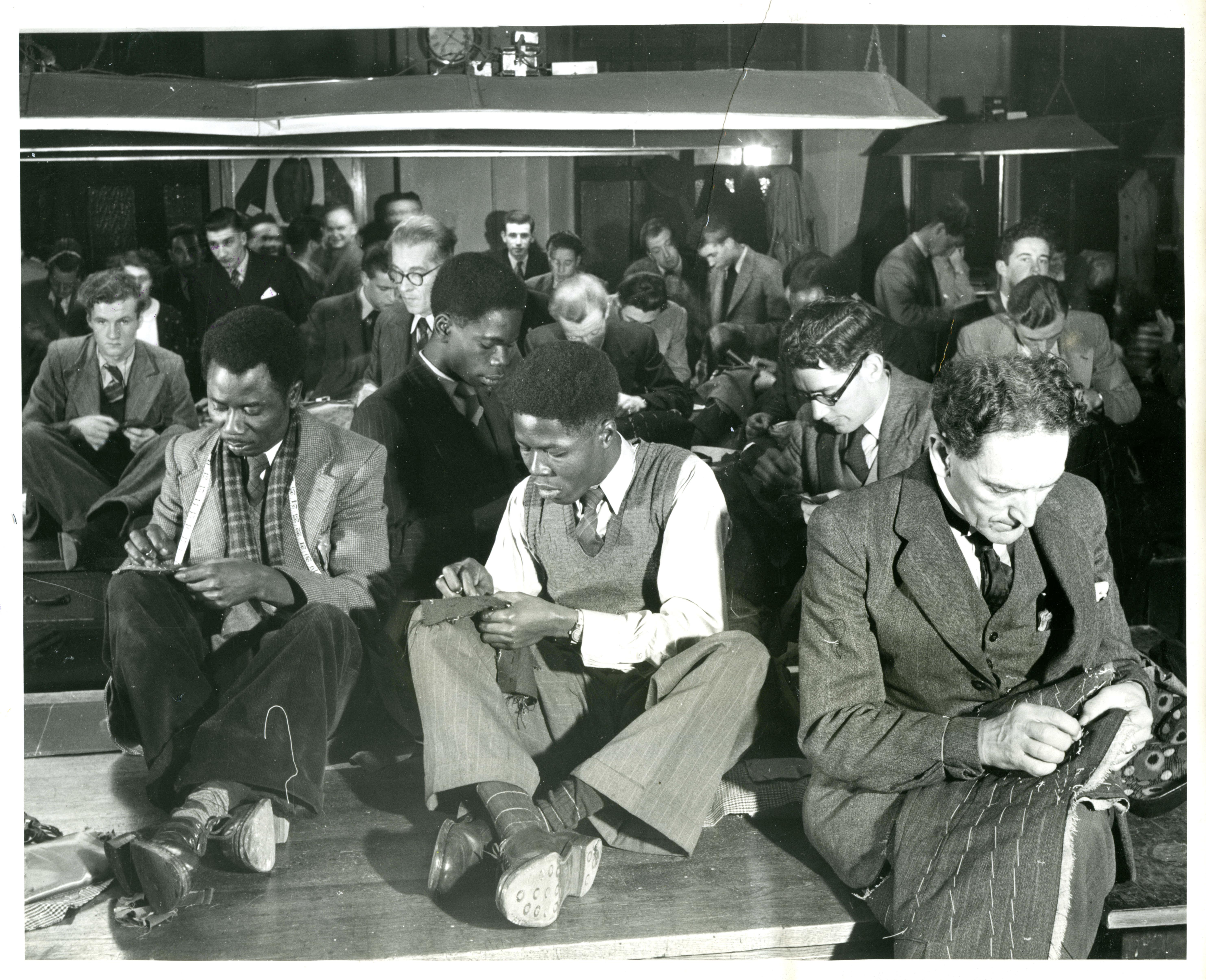 Men sewing. Photograph taken in 1949.