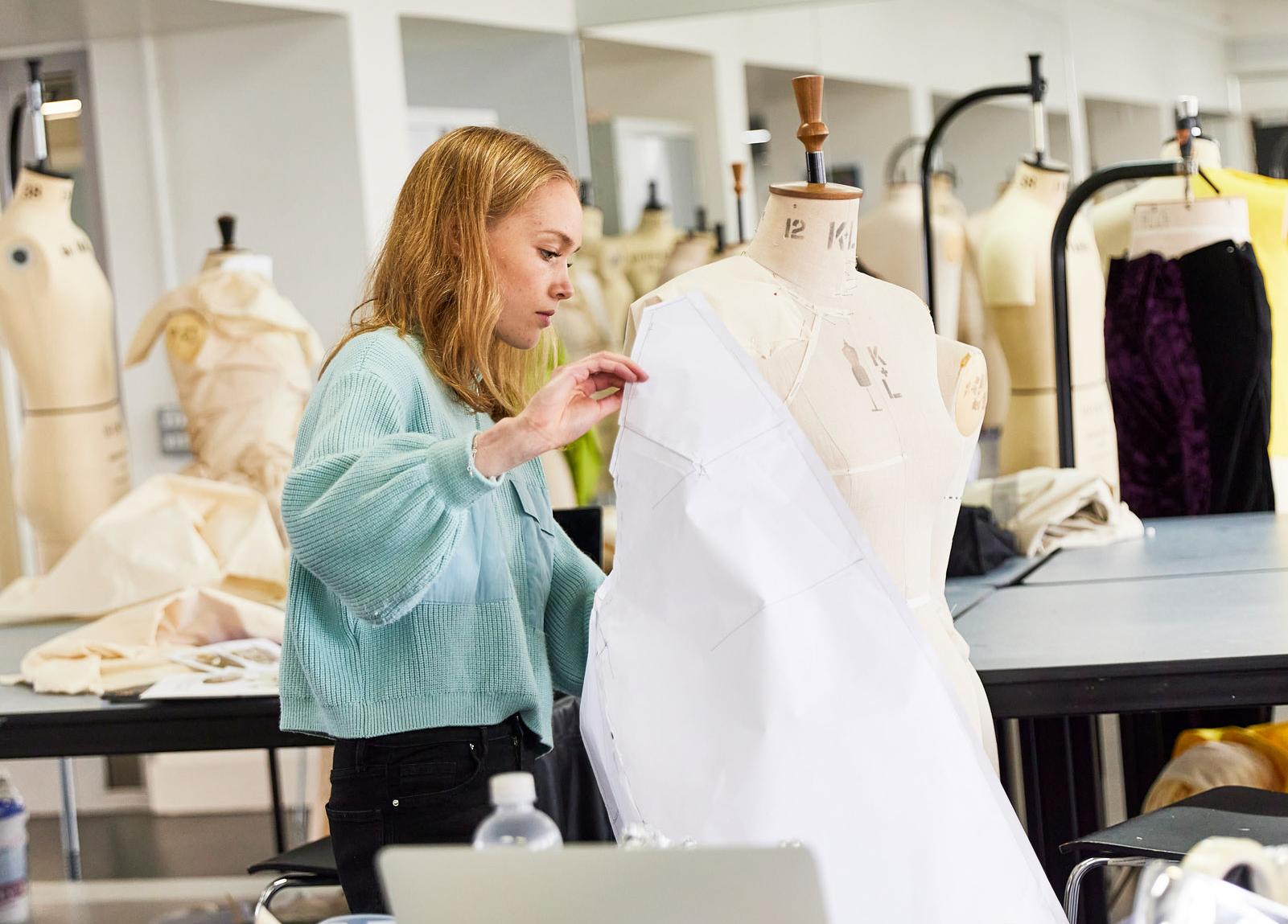 Student working on a mannequin in the fashion studios at Harrow Campus