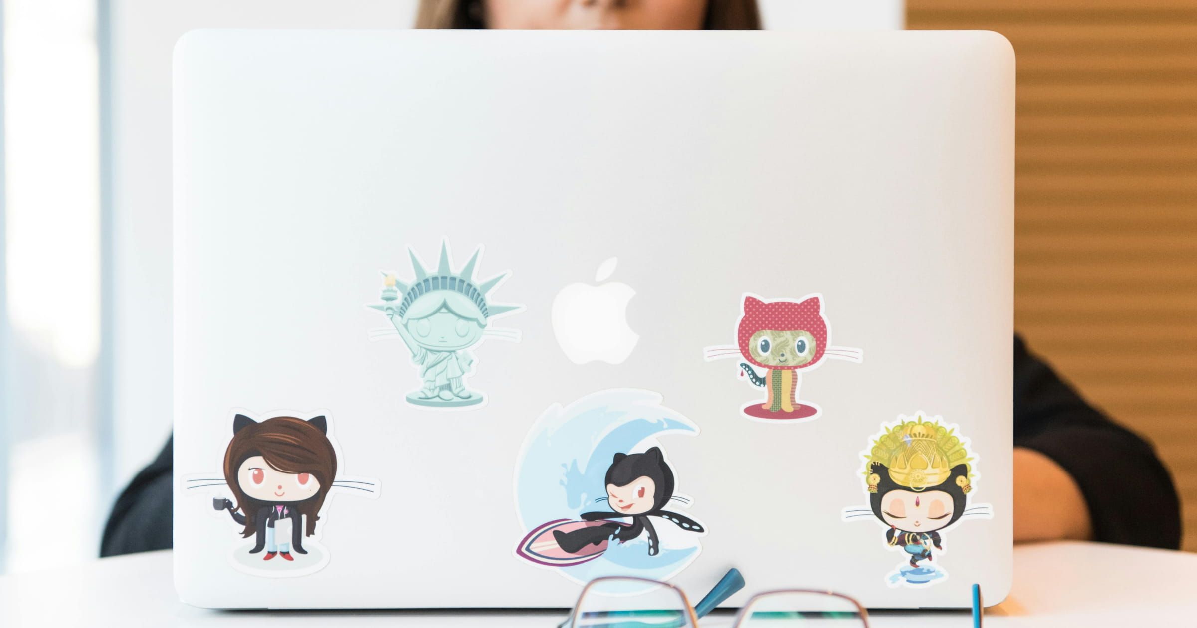 Laptop with stickers of GitHub mascots