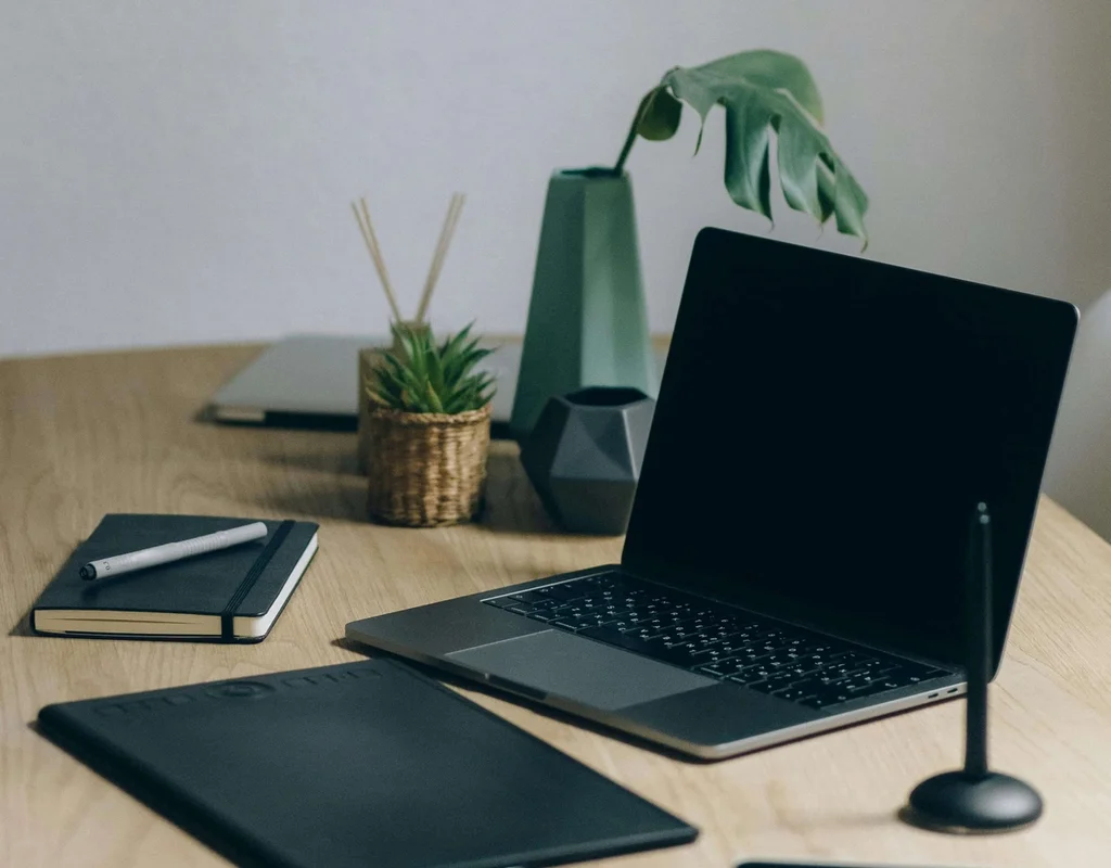 Minimalist desk with laptop and a mobile phone