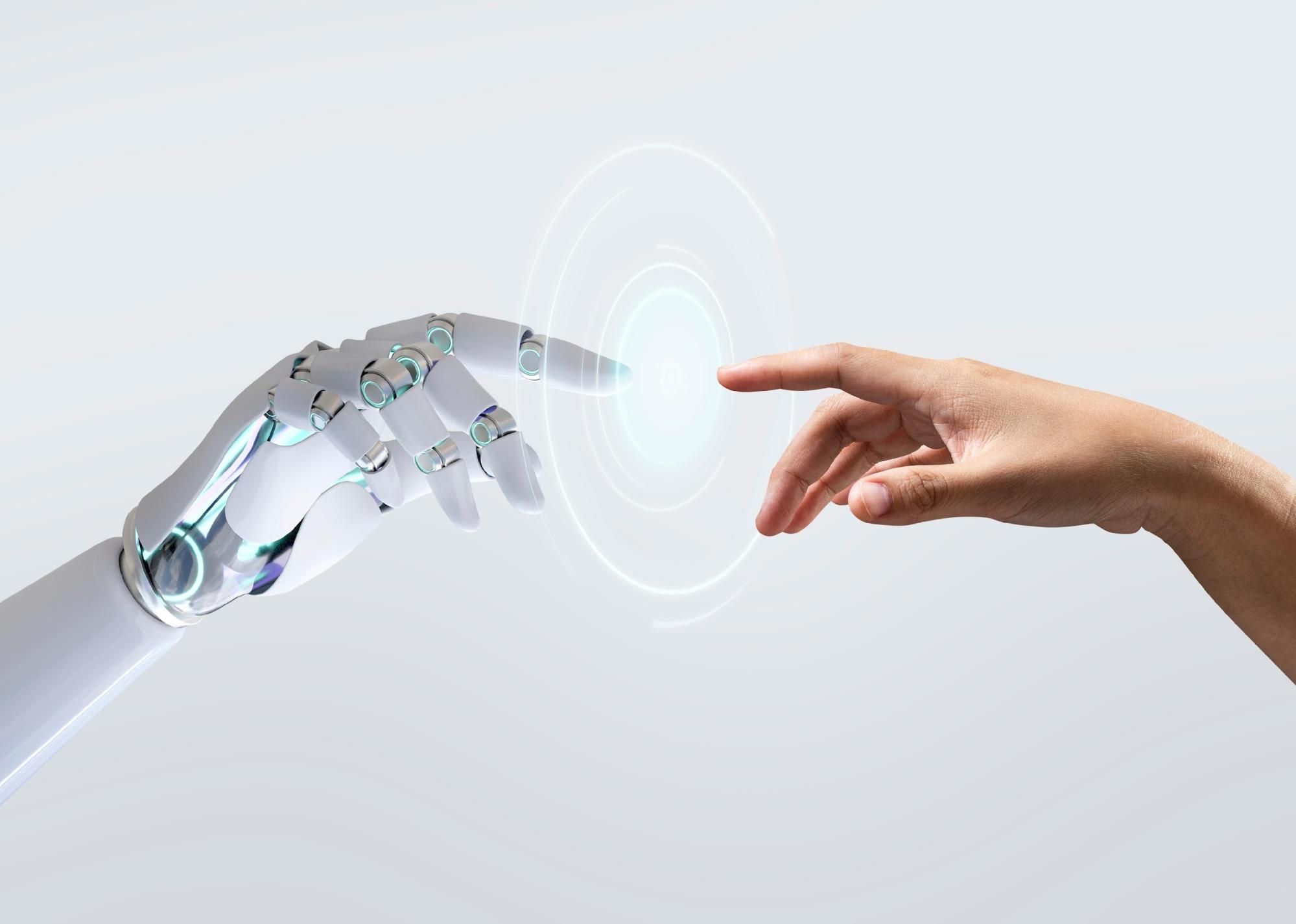 Robot "AI" hand and human hand pointing towards each other