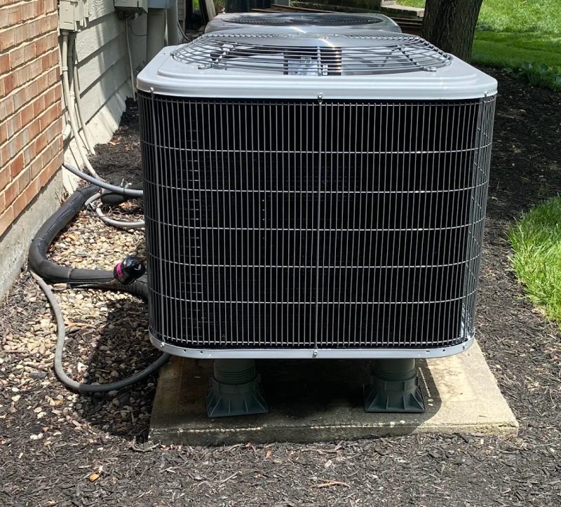 Outdoor air conditioner condenser unit installed by Watson Heating + Cooling