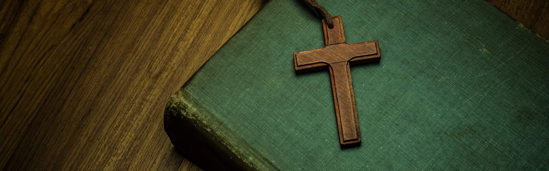 Bible and a Cross on a table