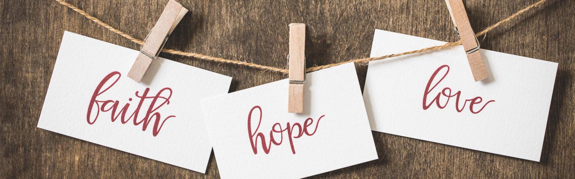 Faith, hope, love on note cards.