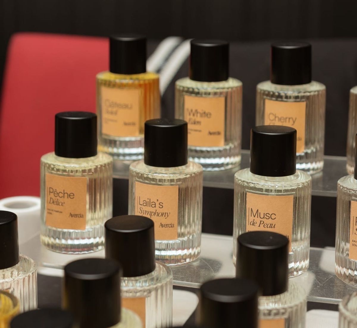 Avercia perfume bottles including Pêche Délice, Laila's Symphony and Musc de Peau