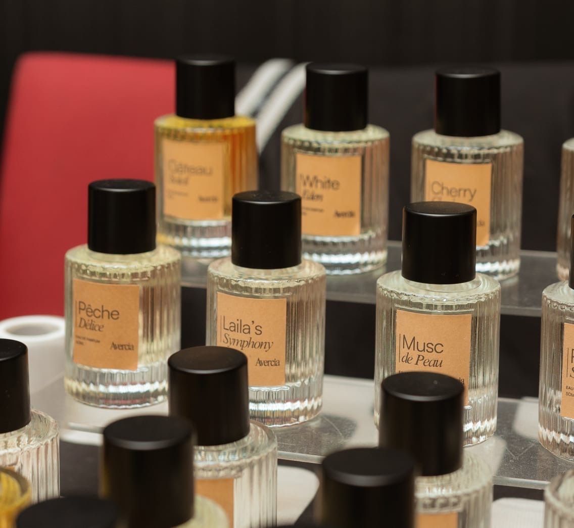Avercia perfume bottles including Pêche Délice, Laila's Symphony and Musc de Peau