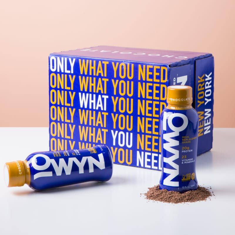 OWYN Chocolate Meal Replacement Shakes on a table