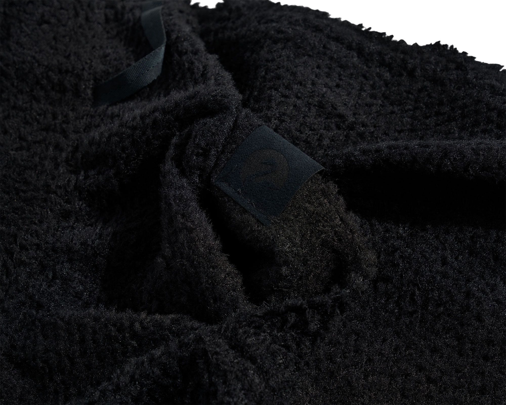 Ultrasuede 30mm label on rear right pocket
