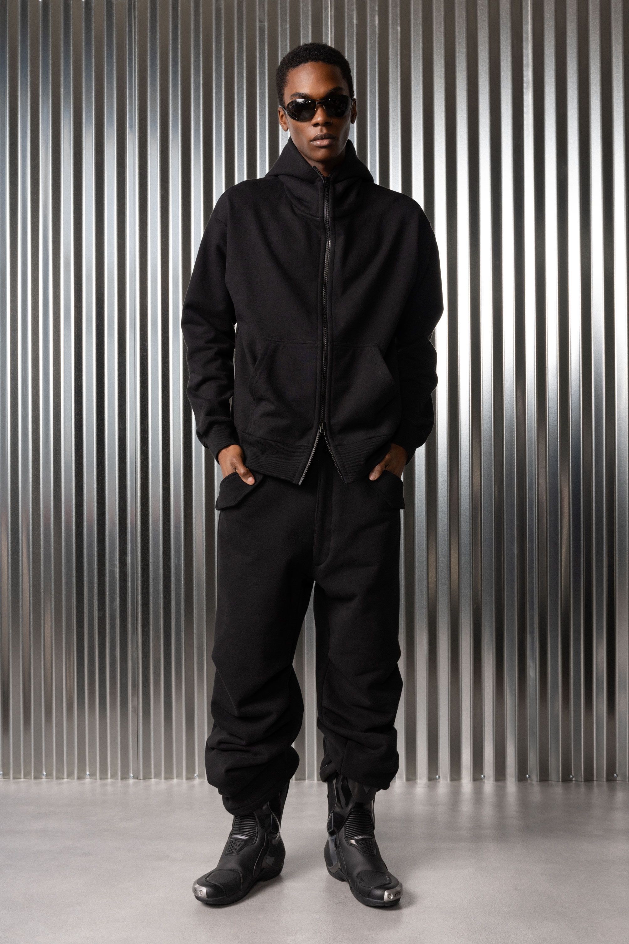 Odinaka is 6'1", 143 lbs and wears size M in Od Black. Worn with Thiccotton Bubblegliders in Black.