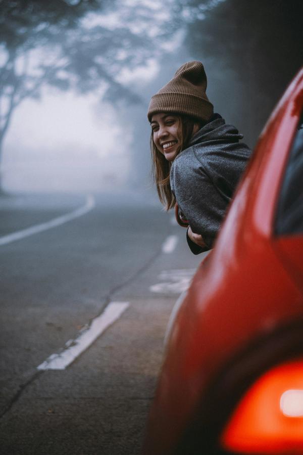 woman in the red car