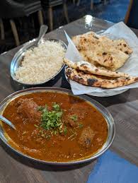 Any Lamb Curry on Rice + Naan $13.00