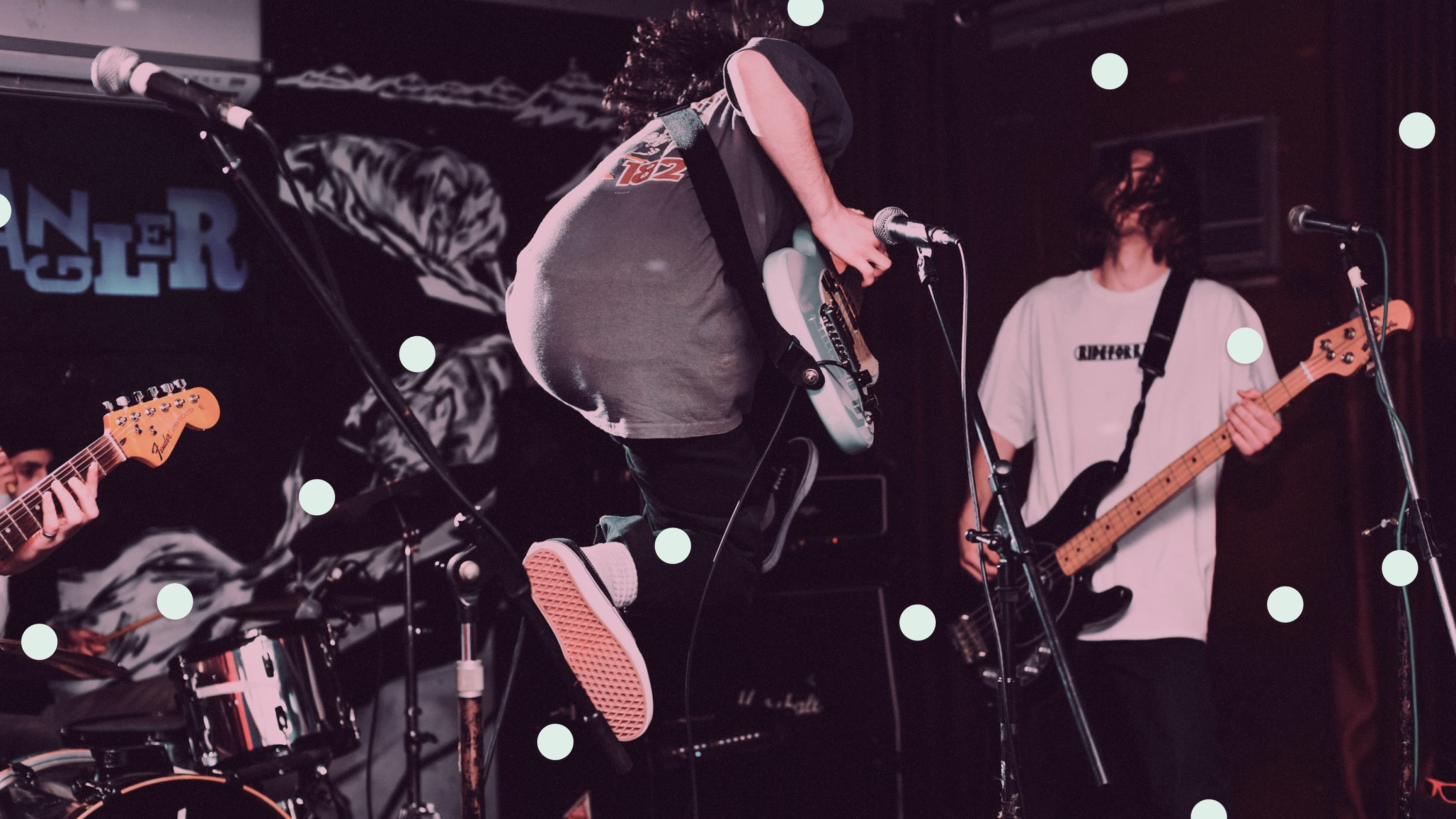 Guitarist jumping on stage, overlaid with mint circles.