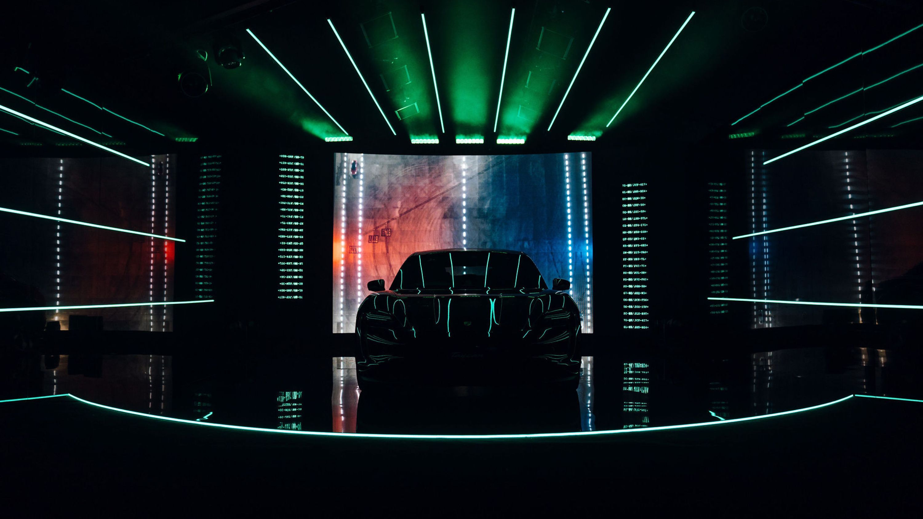 Front view of the Taycan on the custom stage.