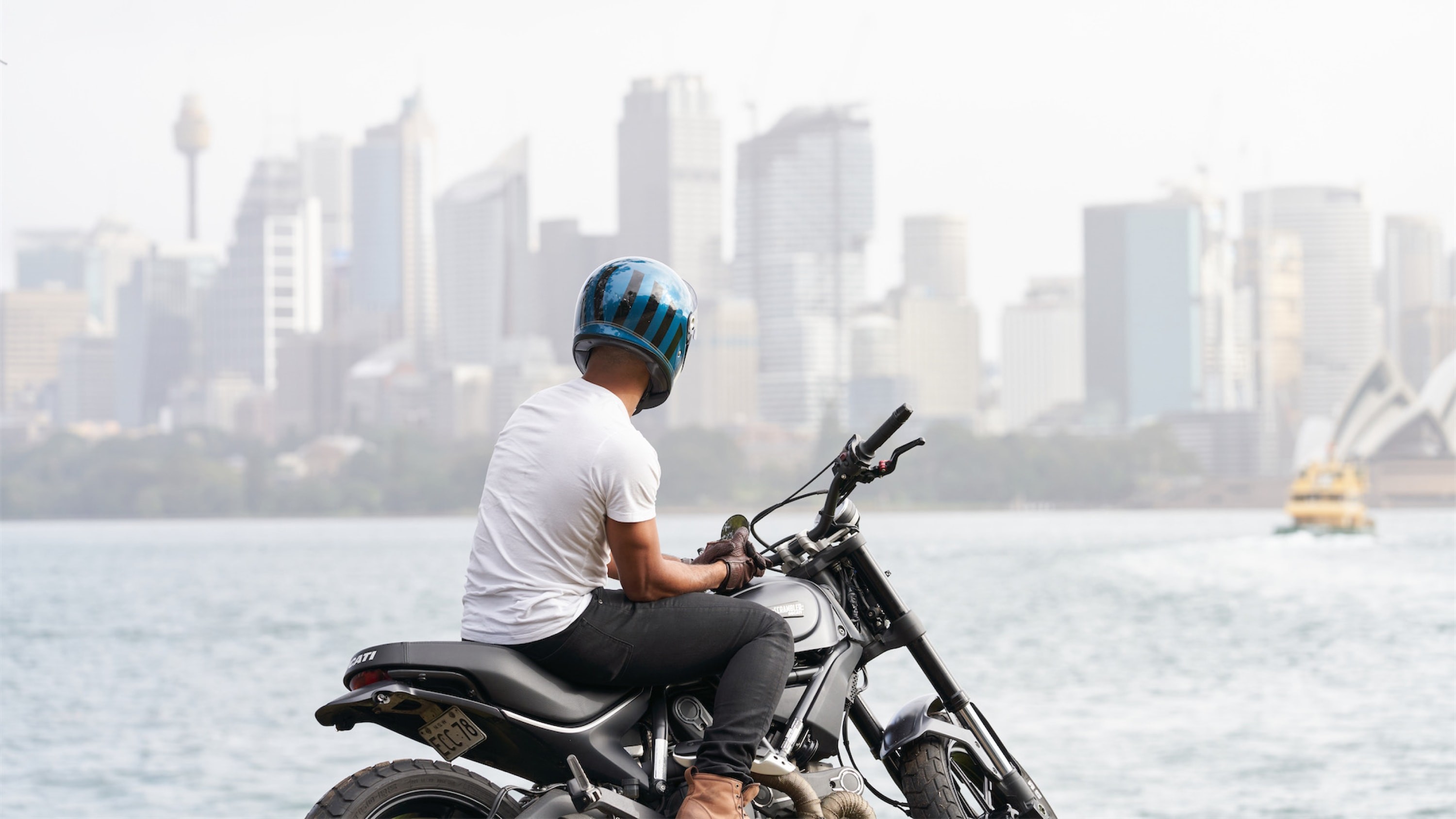 Talent on motorcycle viewing Sydney harbour.