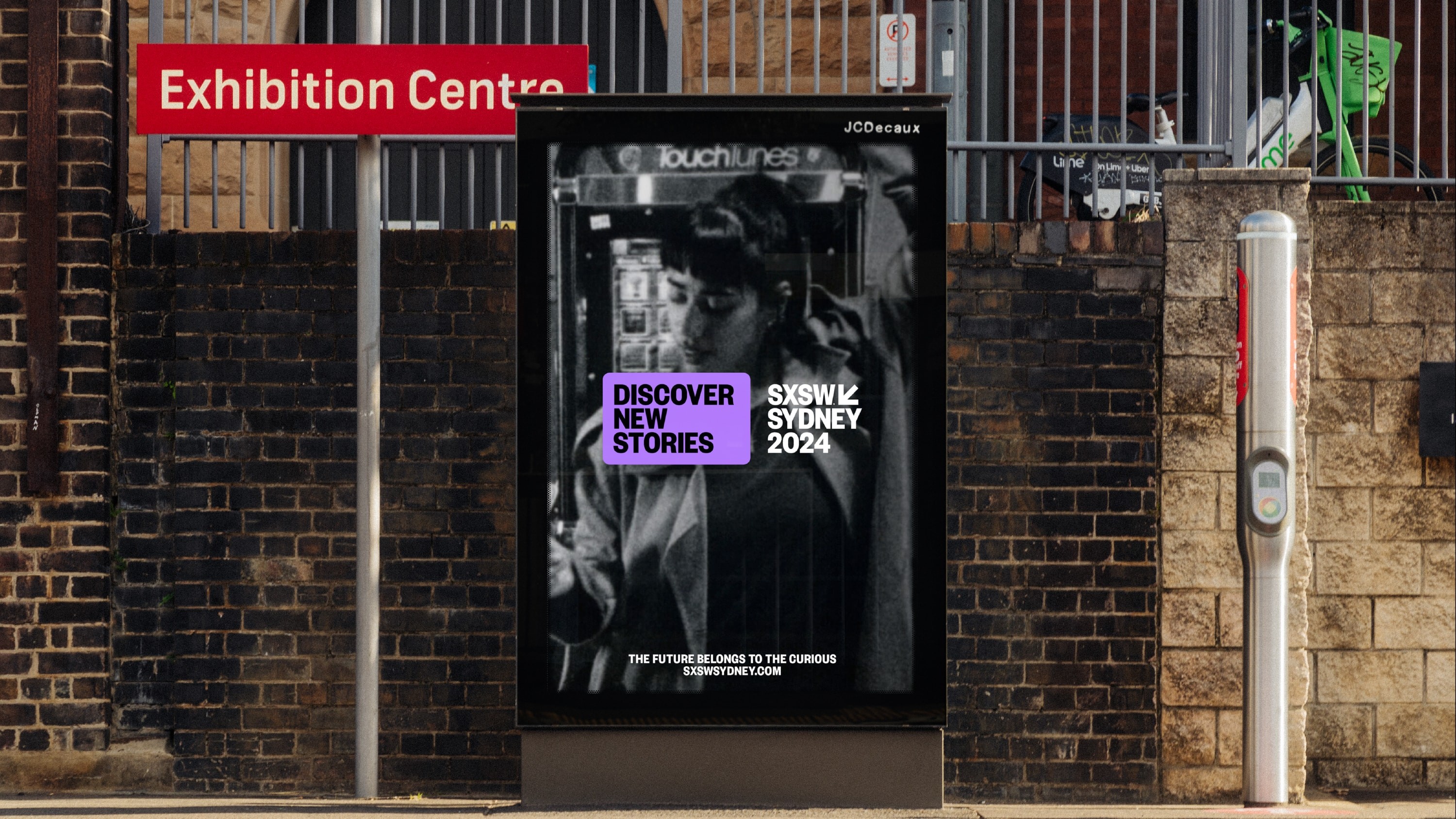 Outdoor sign with image and SXSW Sydney branding.