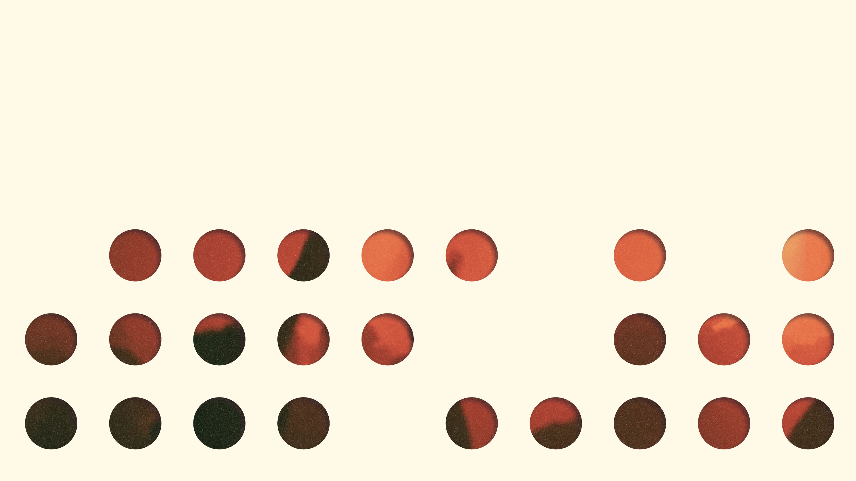 Circular cutouts reveal red concert photography beneath a cream field.