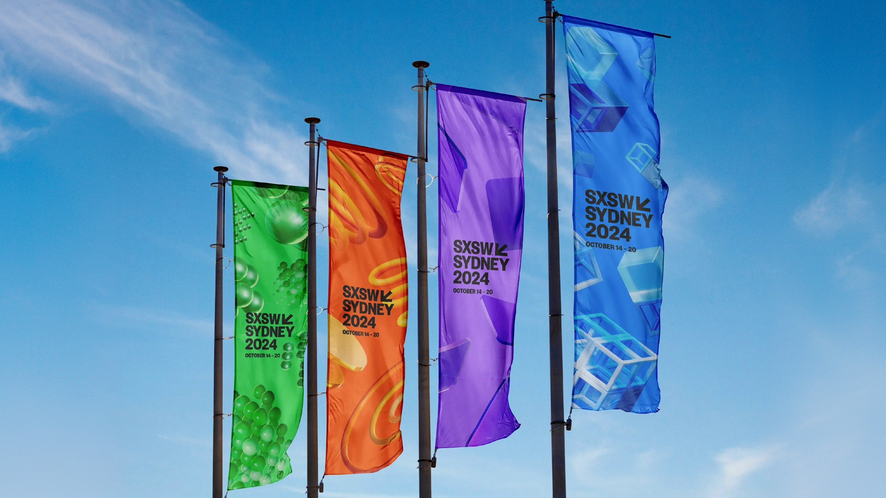 Flags with the logo and different coloured 3D objects.