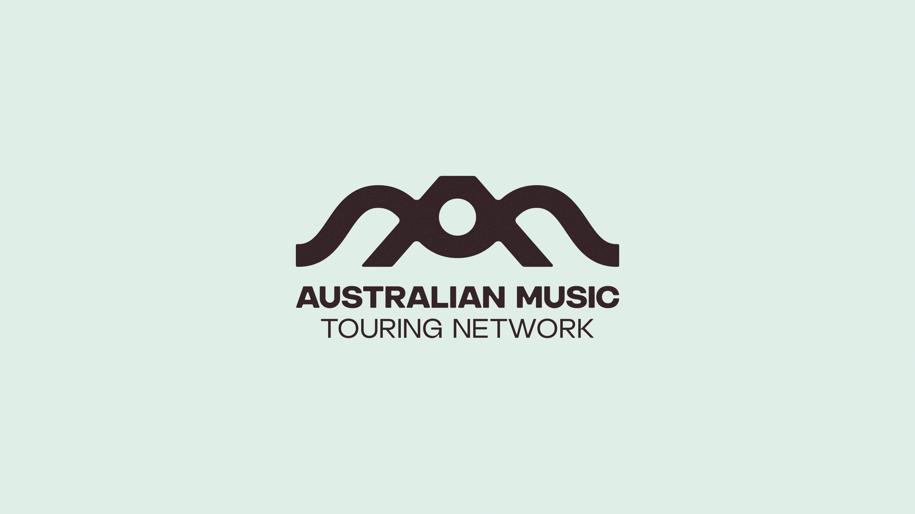 AMTN logo with a wave-shaped AM symbol above the name.
