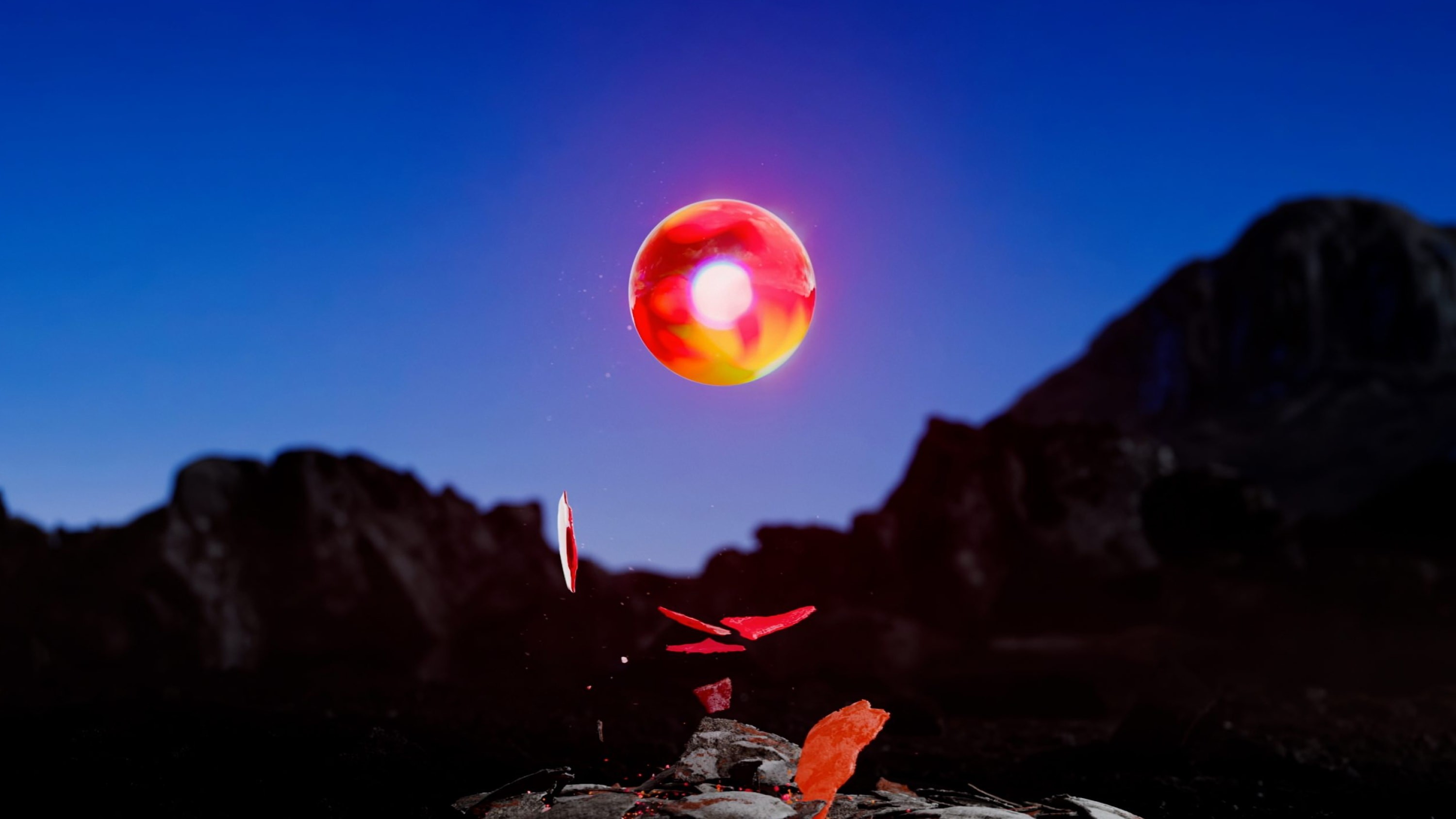 Illuminated sphere with a backdrop of mountains.