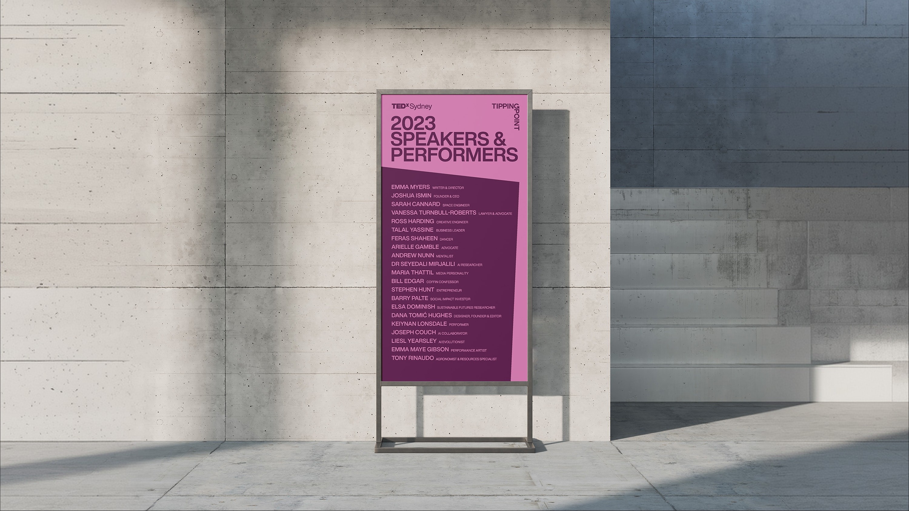 Branded sign with list of speaker and performers.