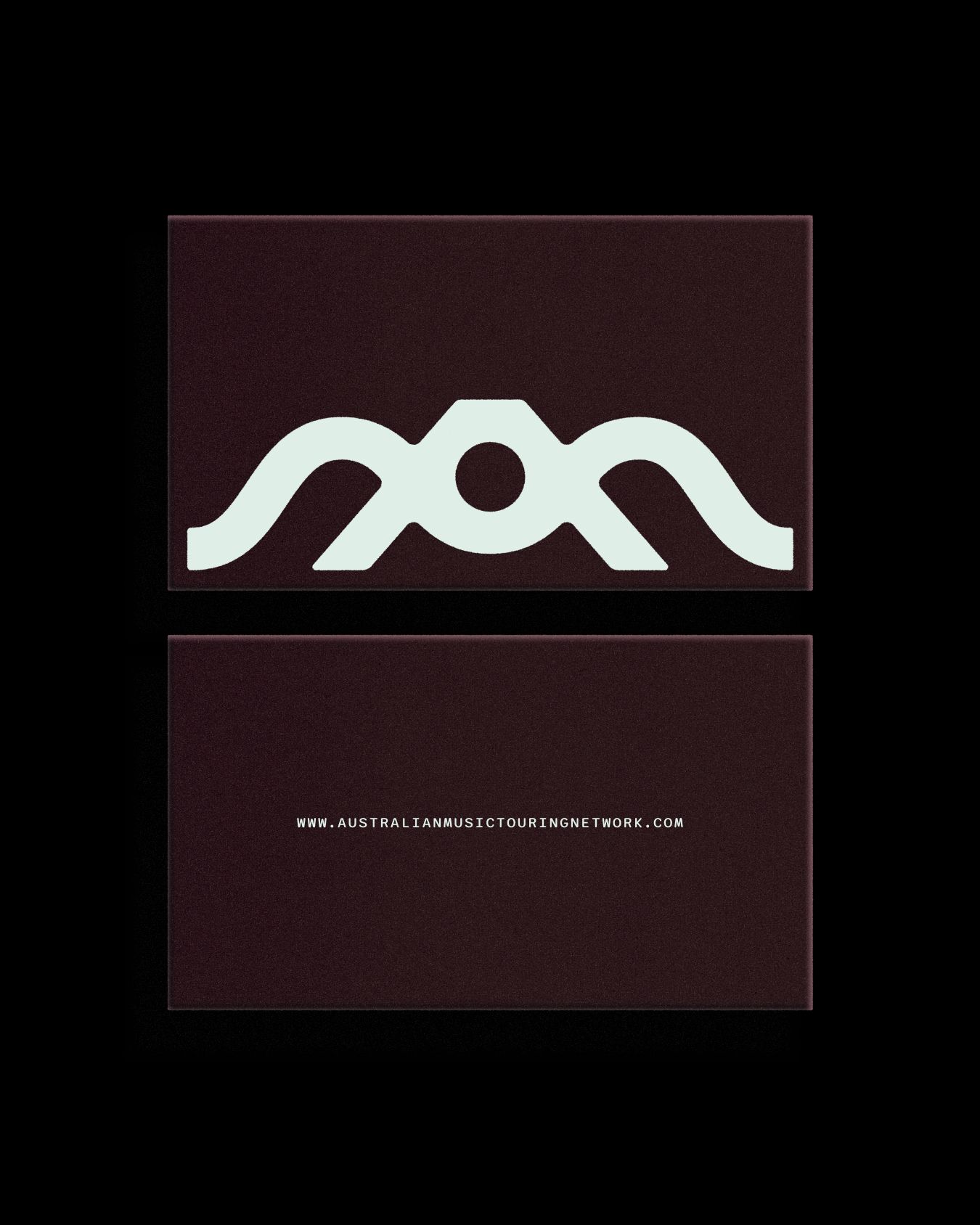 Dark brown cards showing the AMTN symbol and website address.