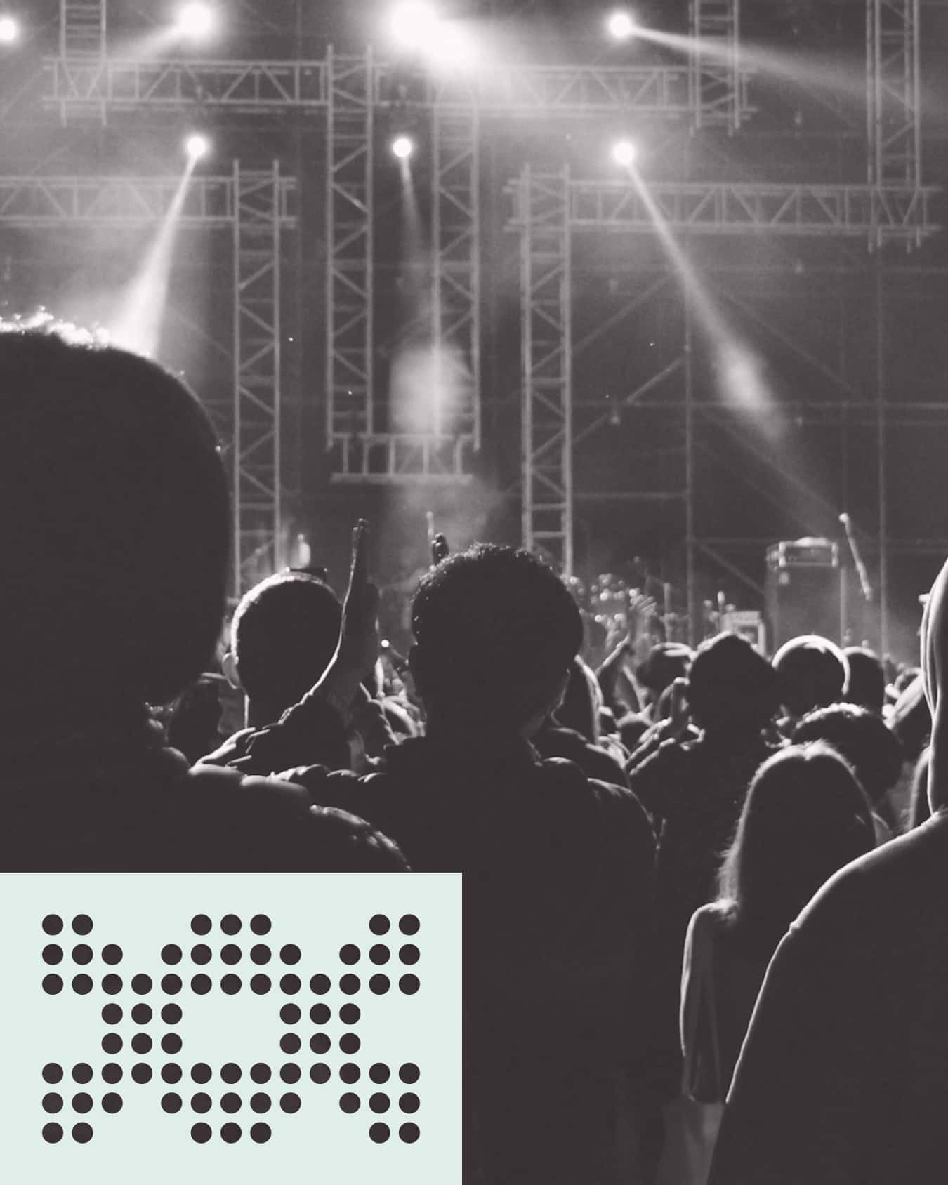 Black-and-white concert crowd with a mint panel of circular cutouts.